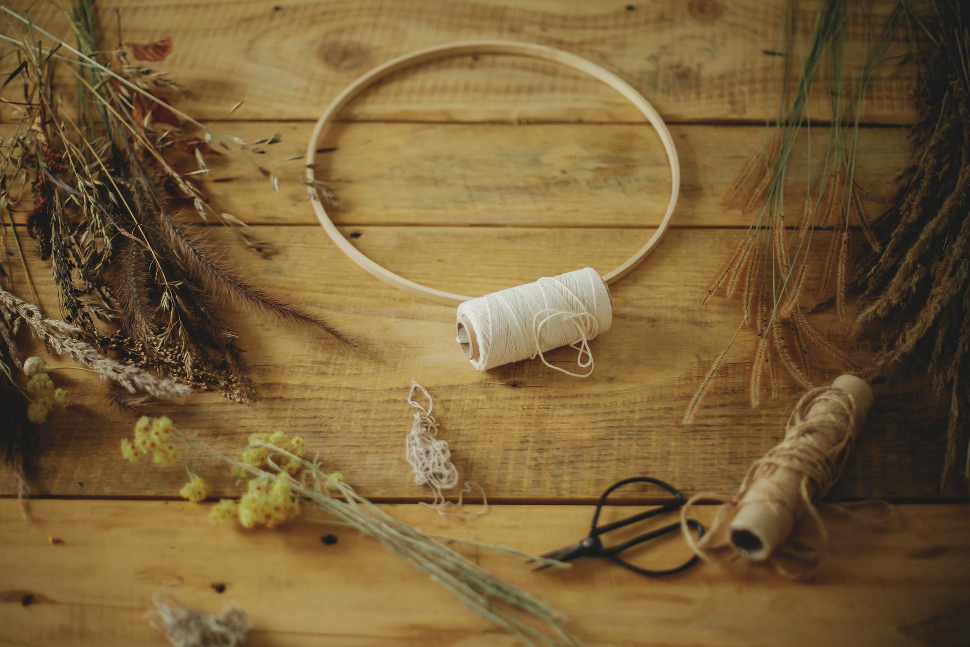 Studio workspace with hoops and threads